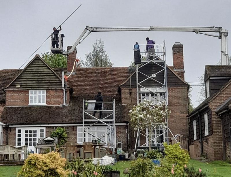 The Roof Moss Cleaners using cherry picker and scaffolding to clean roof safely and professionally in Cinderford, Gloucestershire