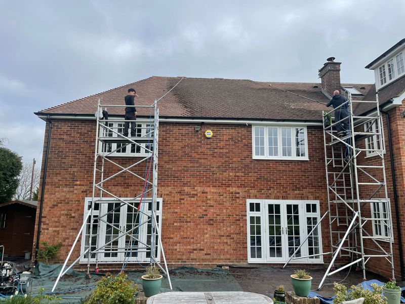 Roof cleaning carried out safely from scaffold towers by The Roof Moss Cleaners in Cinderford